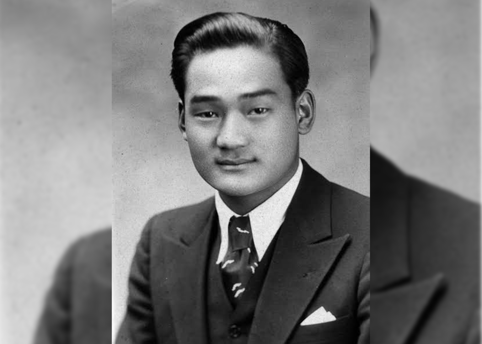 American lawyer and civil rights activist Minoru Yasui is posing for an official looking photo. He’s particularly known for challenging the discriminatory policies placed on Japanese Americans.